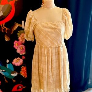 Jodifl size M cream color with the trellis print just right above the knee.